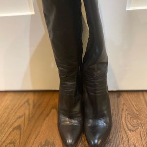 Barneys New York Black leather knee-high wedge heel boots.